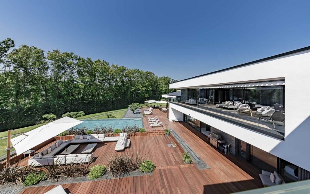Ultima Grand Villa Outdoor Terrace with view of the pool 